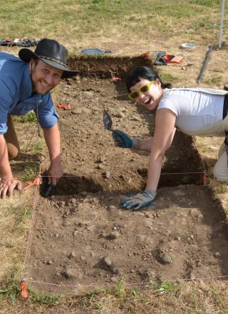 Two students digging during archaeological field school