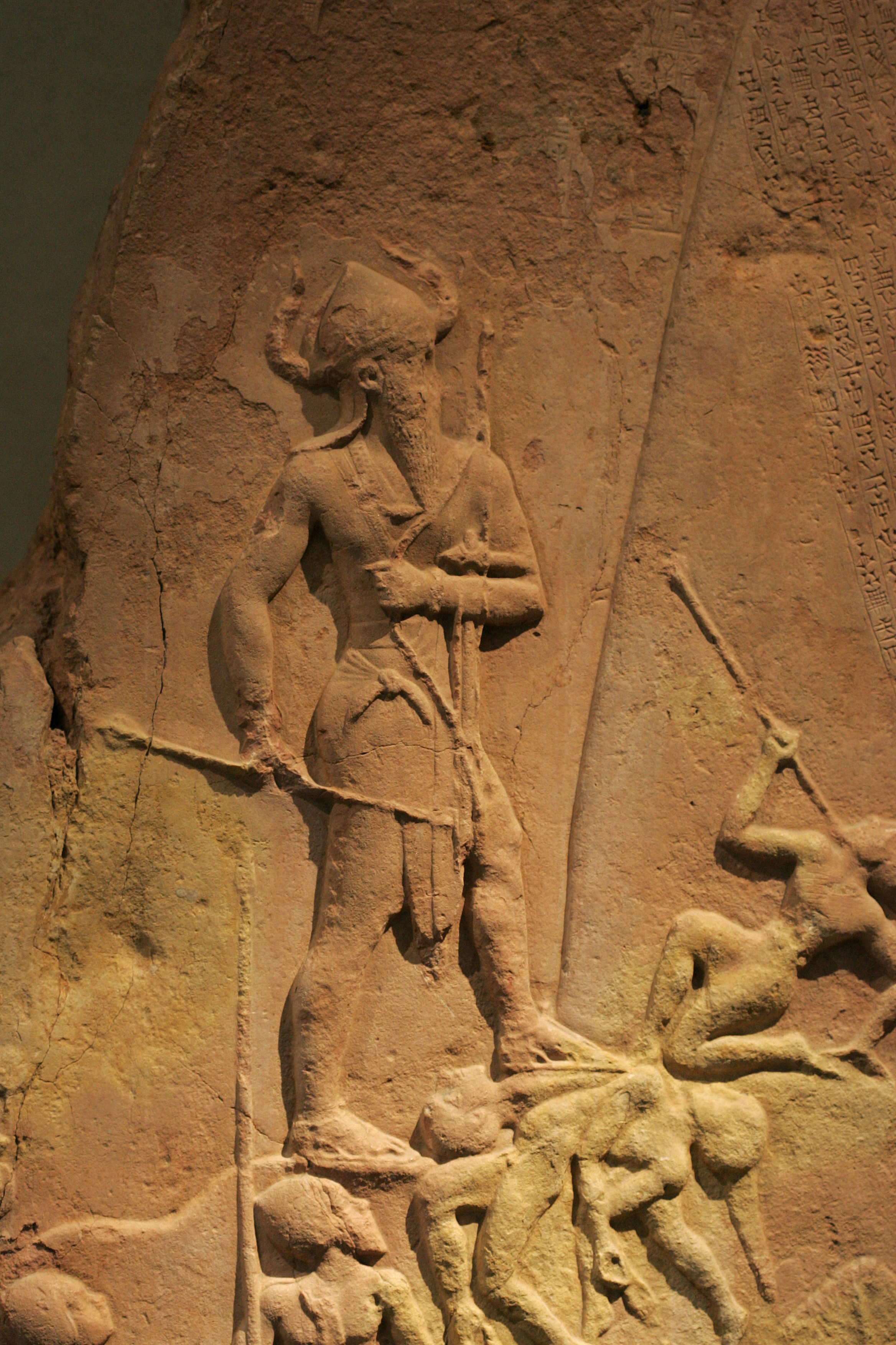 Detail of bas relief sculpture showing Naram-Sin standing on defeated warriors