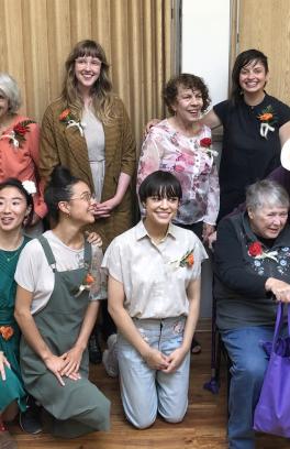 Group of MFA students and seniors citizens at the Hollywood Senior Center pose for a group photo
