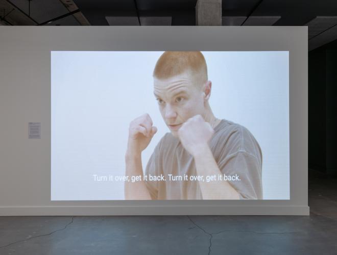 Video projection showing Nolan Hanson's Trans Boxing project.