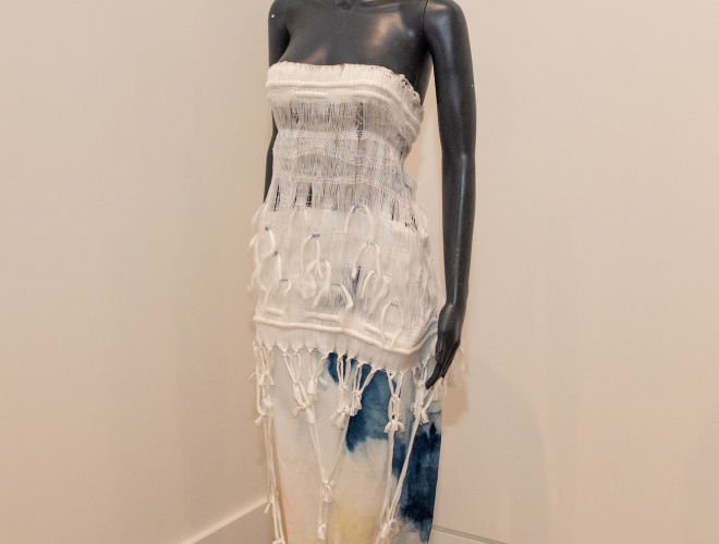Woven textile dress on a mannequin.