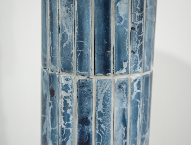 Detail of lamp base made from blue ceramic tiles.