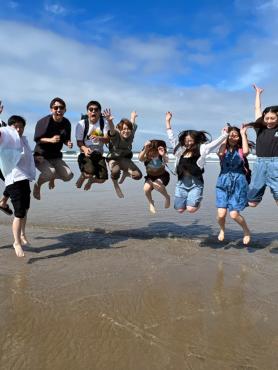 Students jumping at Beach