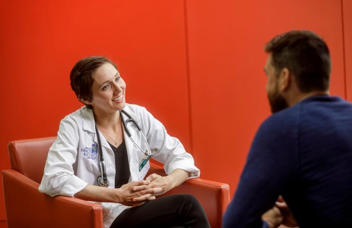 A student talking with a doctor.