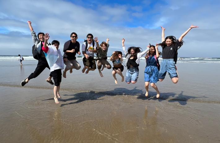 Students jumping at Beach