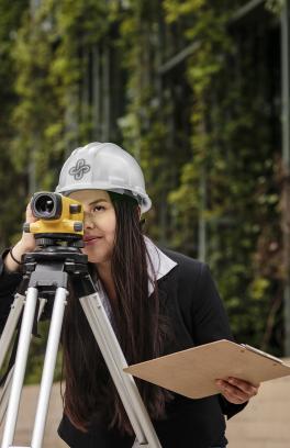 Engineering student using plane surveying equipment