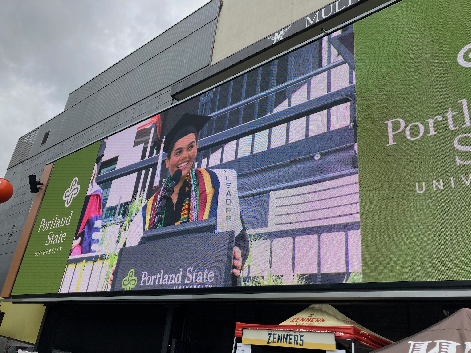 Student speaker on stadium screen at Providence Park