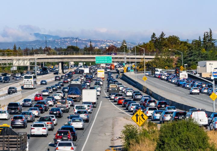 Heavy automobile traffic on a multi-lane freeway in California.