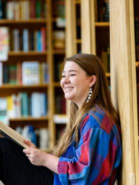 Student sitting and reading in Powell's Books