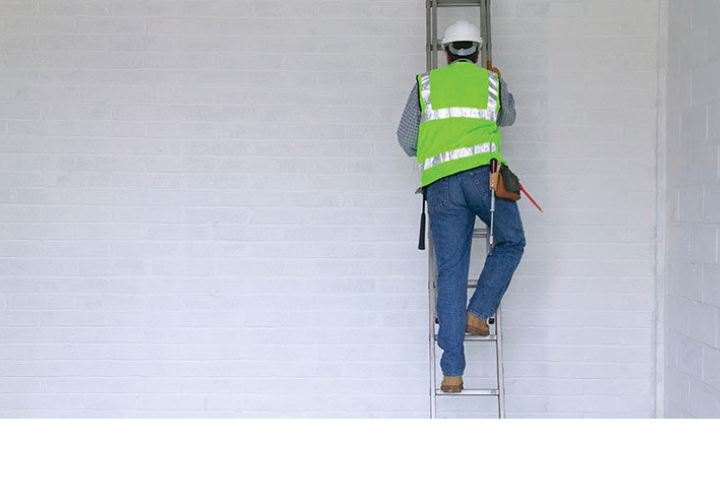person climbing ladder with back towards viewer
