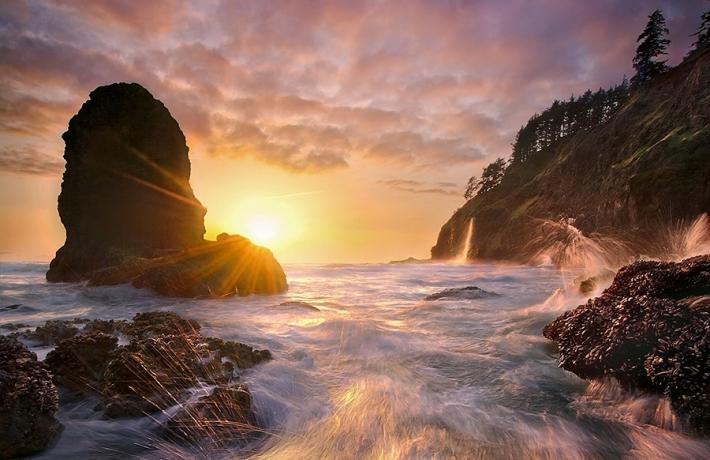 Summer 2023 Newsletter Cover Oceanside Coastal Oregon sunset headland, rocks, waves crashing