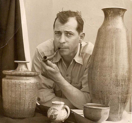 Ray Grimm with collection of his ceramic work