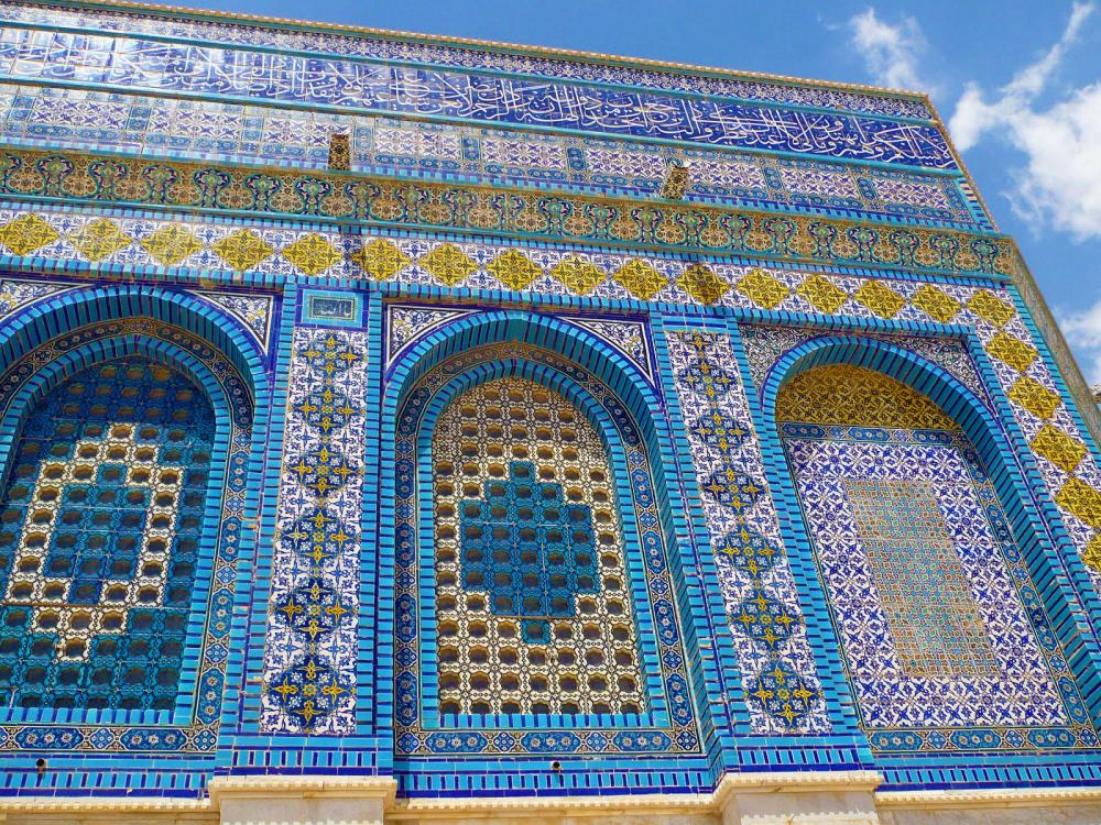Colorful tiled facade of a building in the Middle East.