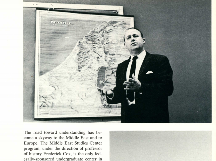 A clip from the Viking Yearbook from 1962 of MESC founder Fred Cox in front of a map.
