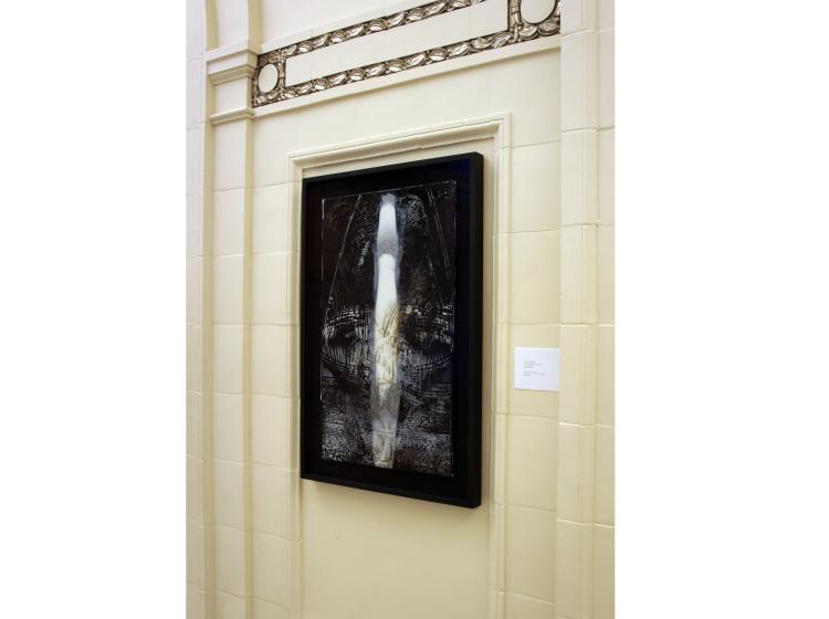 One of the framed artworks is shown on the wall in Lincoln Hall, viewed at an angle