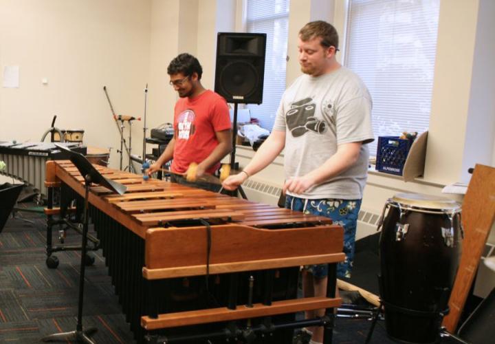 Percussion students rehearsing on a marimba
