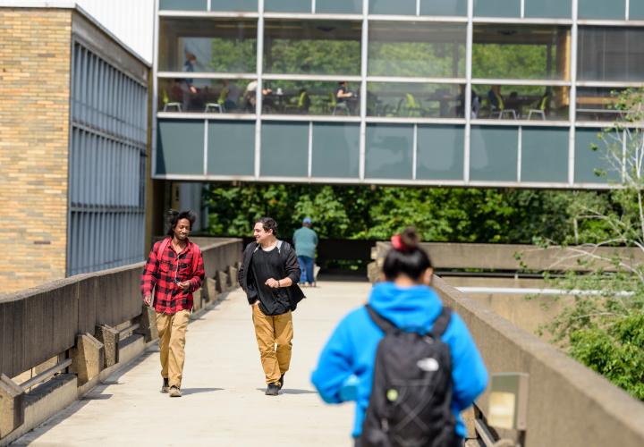 students walking together on PSU sky bridge