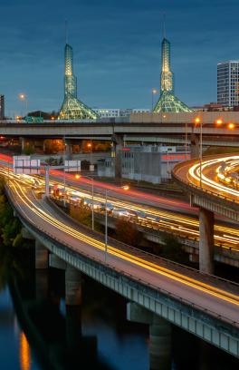 Portland highways at dusk with cars driving by.