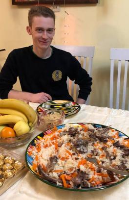 Russian overseas student  with regional food