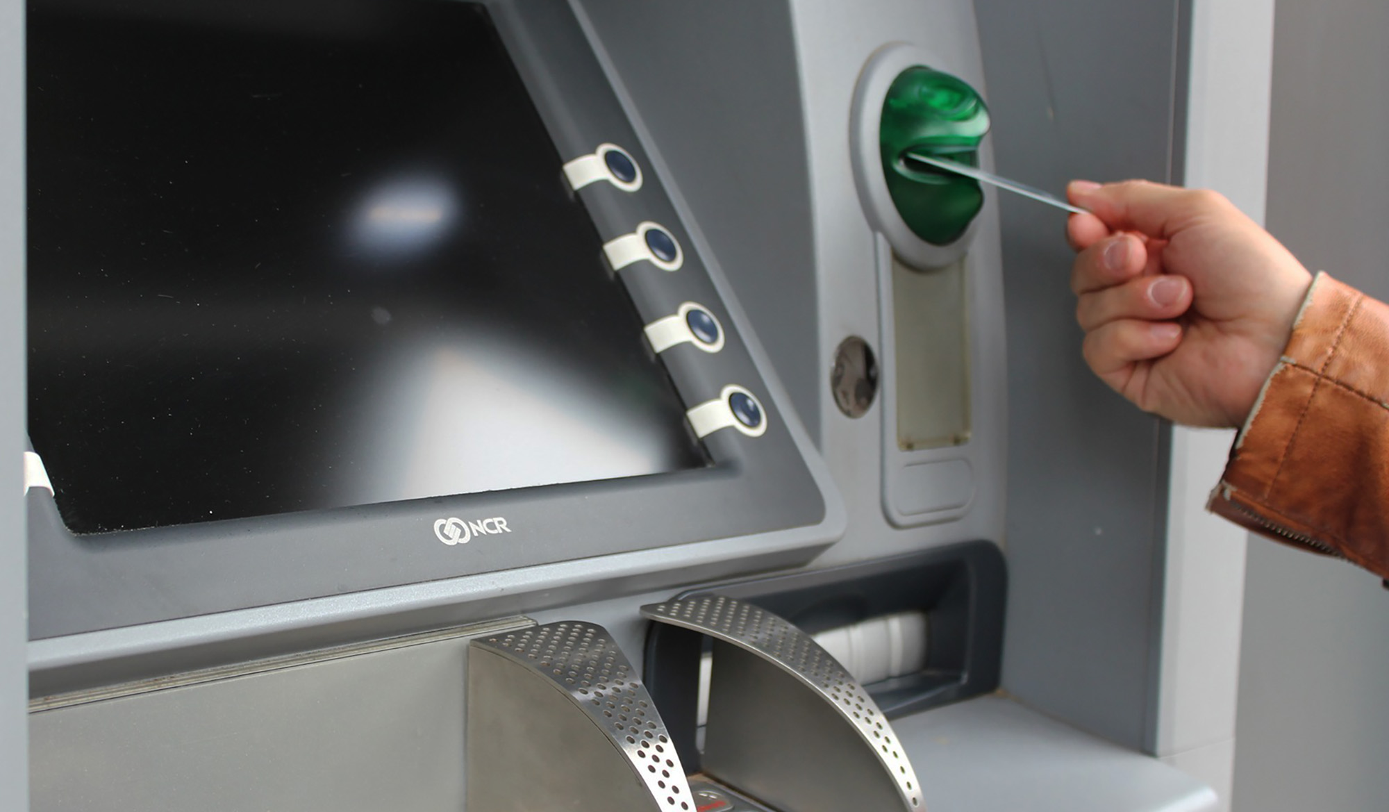Closeup of ATM accepting a card