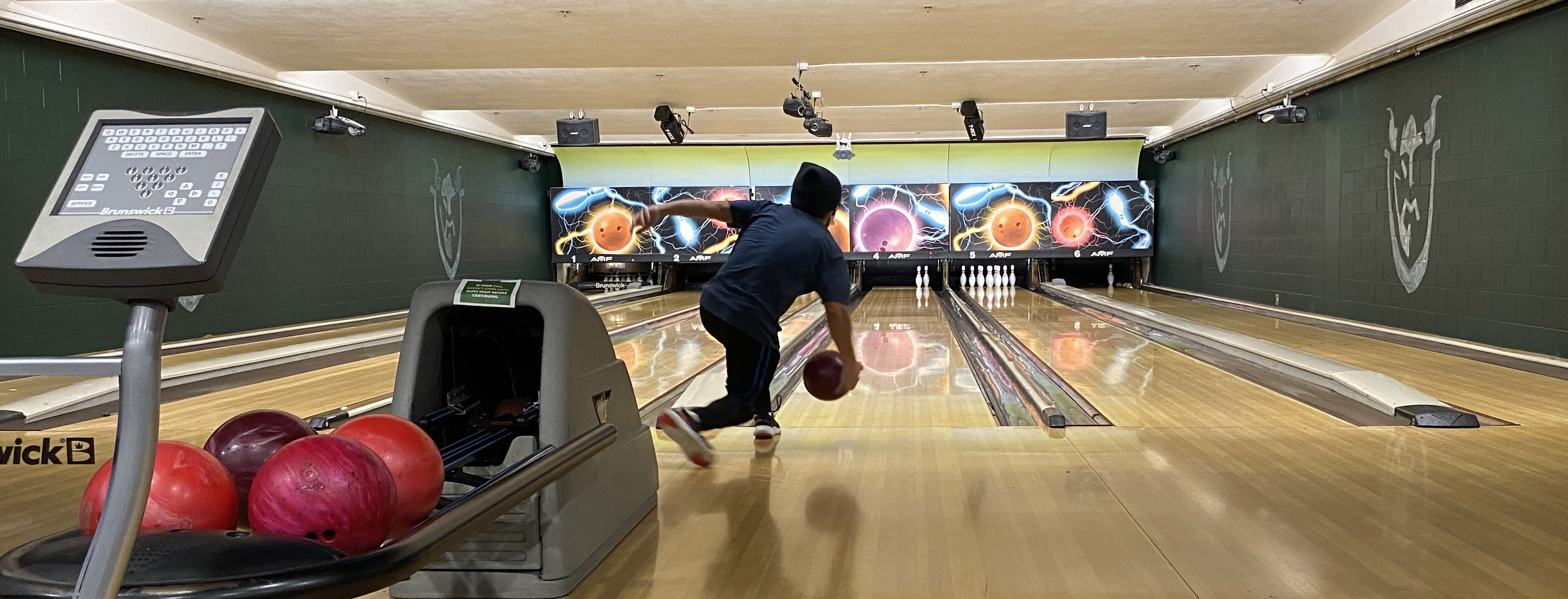 Student bowling in Viking Gameroom