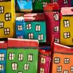 An arrangement of boxes, painted to look like buildings and arranged to look like a city.
