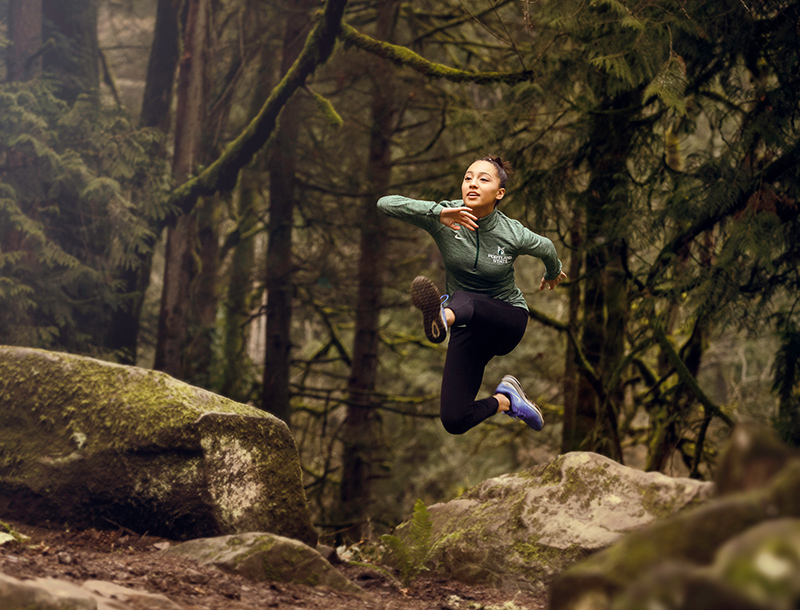 Portland State student running in the forest