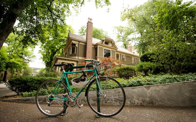 Bicycle parked in front of Simon Benson House