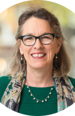 Portrait of Gina Greco, smiling at the camera.