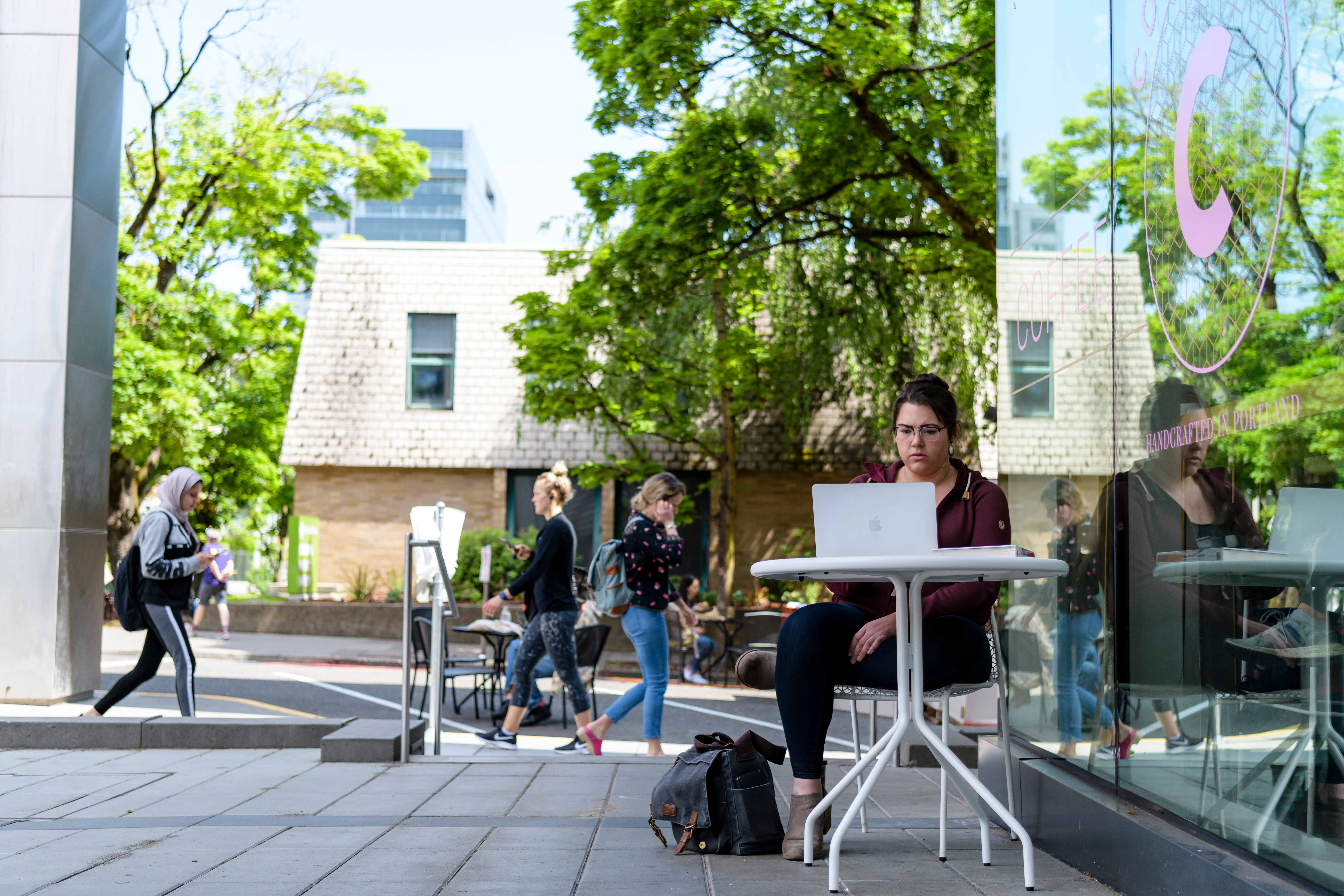 student outside with computer