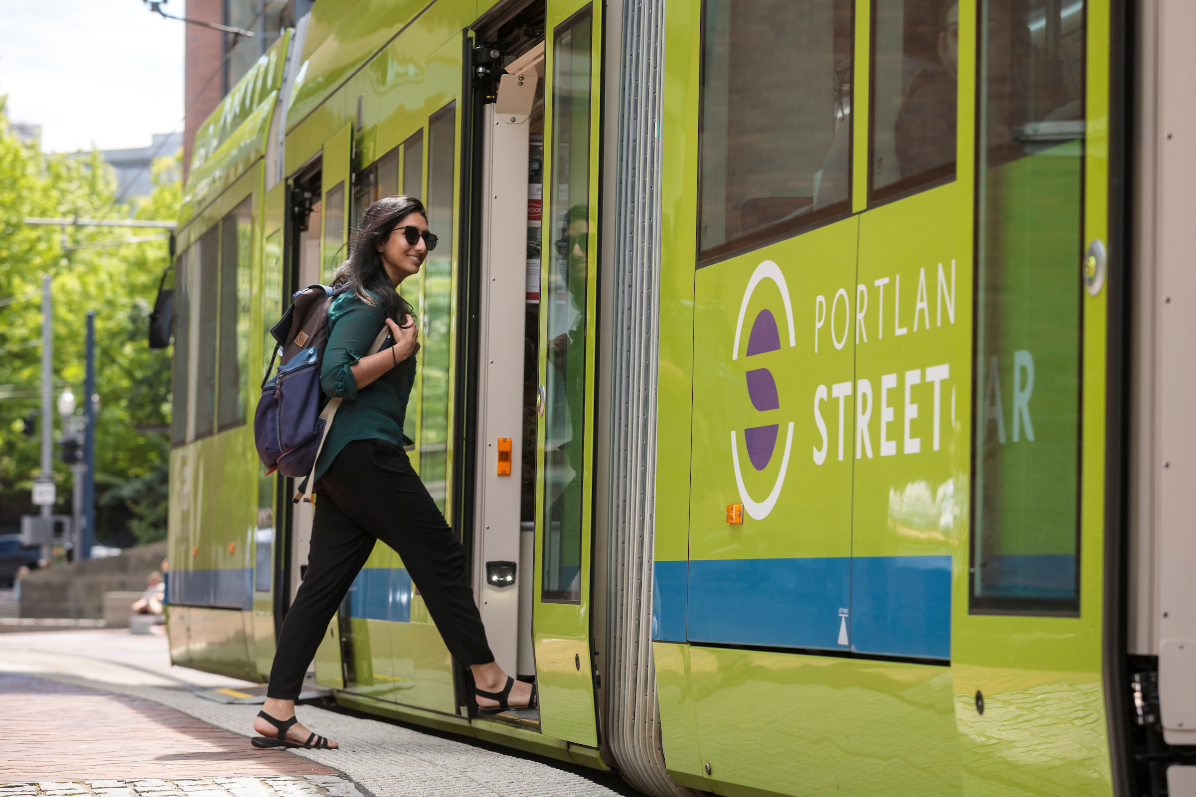 student getting on the street car