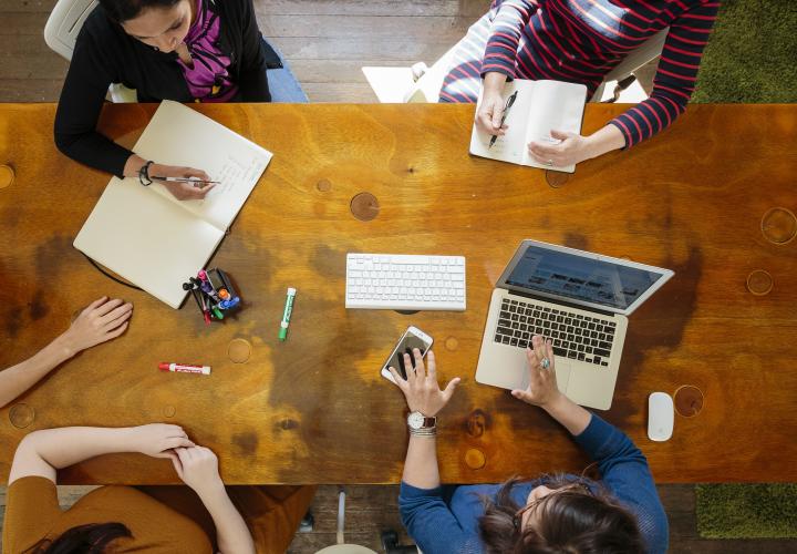 people working at table