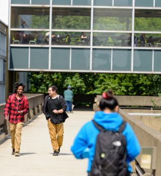 Students walking on skybridge between SMSU and Cramer Hall