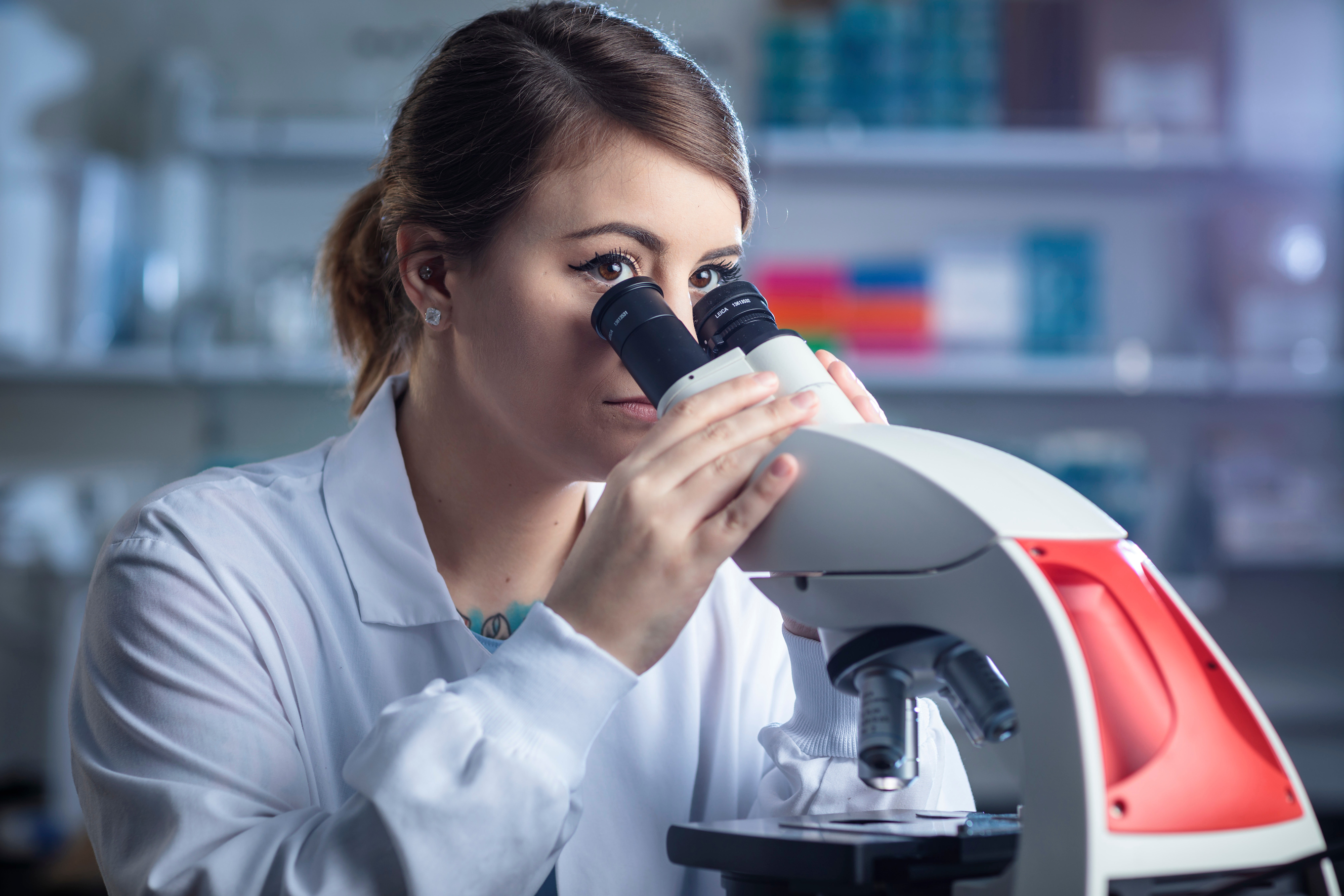 Student using microscope