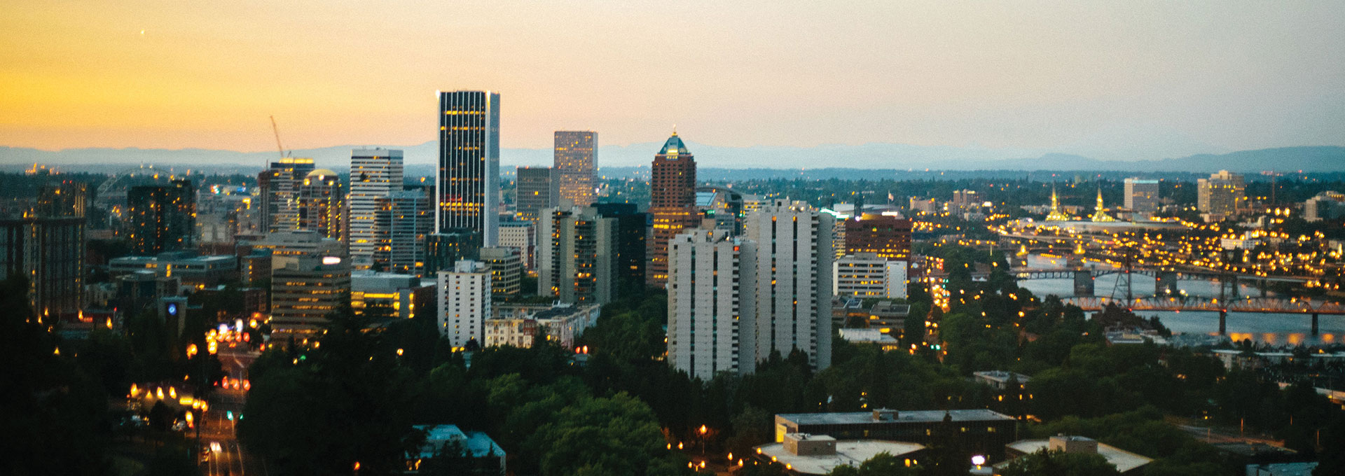 Drone shot of Portland skyline at sunset 