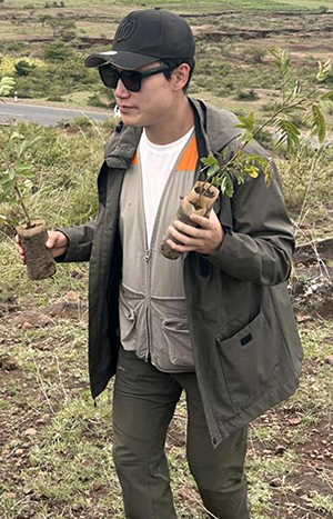 Sunho Kim holding plants