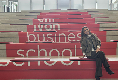Khadija Al Mousa on steps at business school