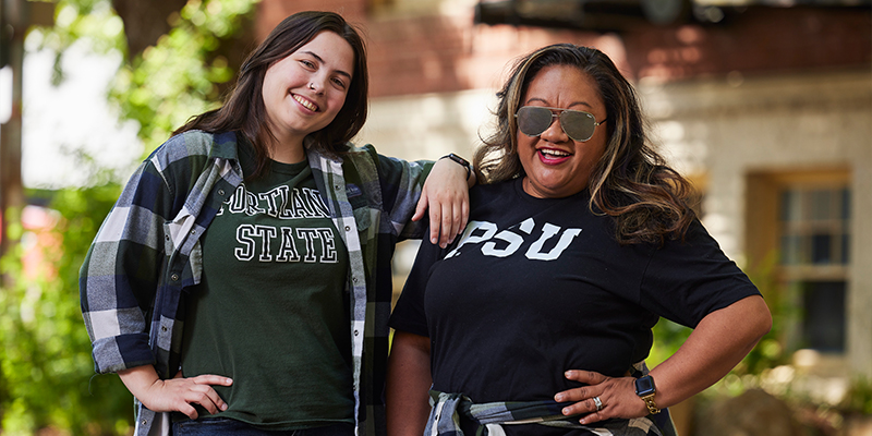 Kanani Porotesano and Stacey Horton in PSU shirts