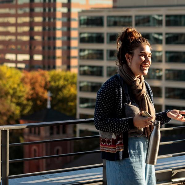 Students talking on the rooftop of the building