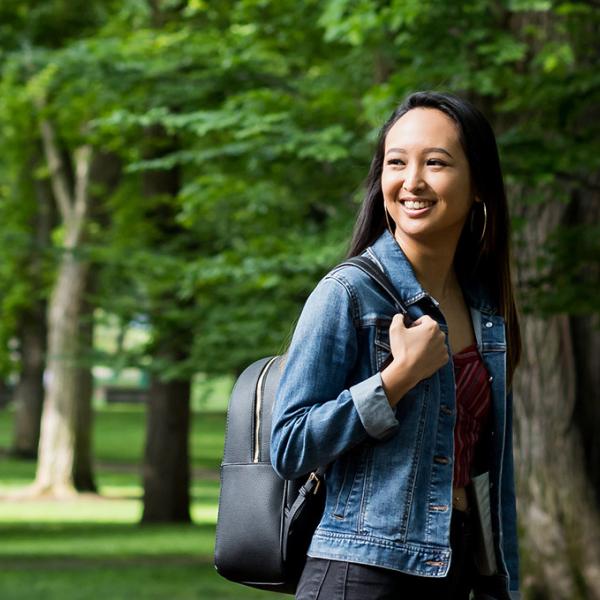 Student walking through the PSU park blocks