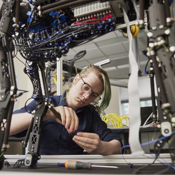 Student working on a dog robot