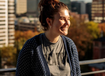 Student on the ASRC roof smiling