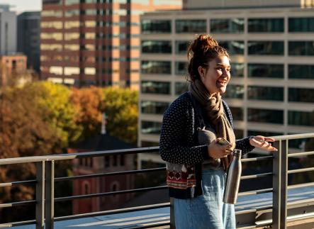 Students talking on the rooftop of the building