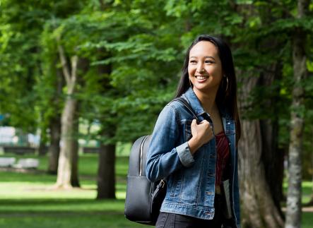 Student walking through the PSU park blocks