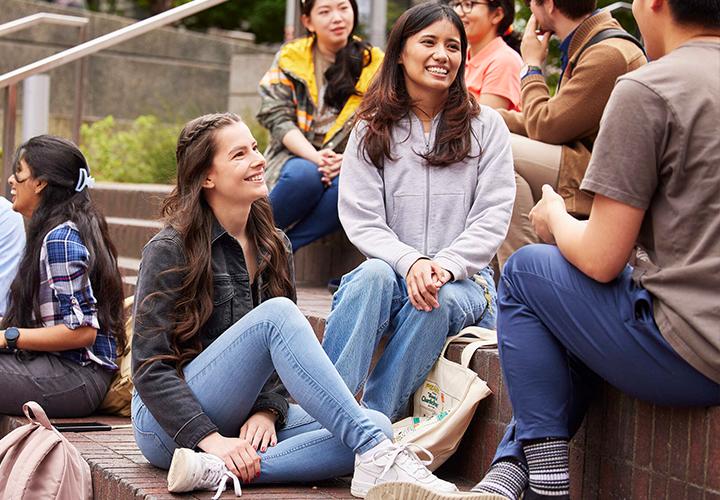 PSU students chatting in the Urban Plaza 