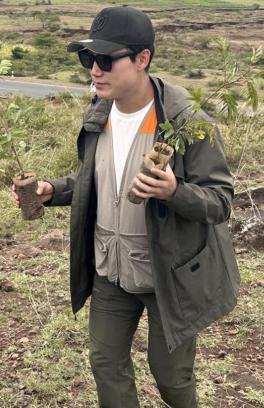 Sunho Kim holding plants