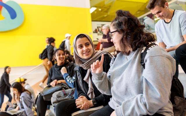 Students sitting in Karl Miller Center