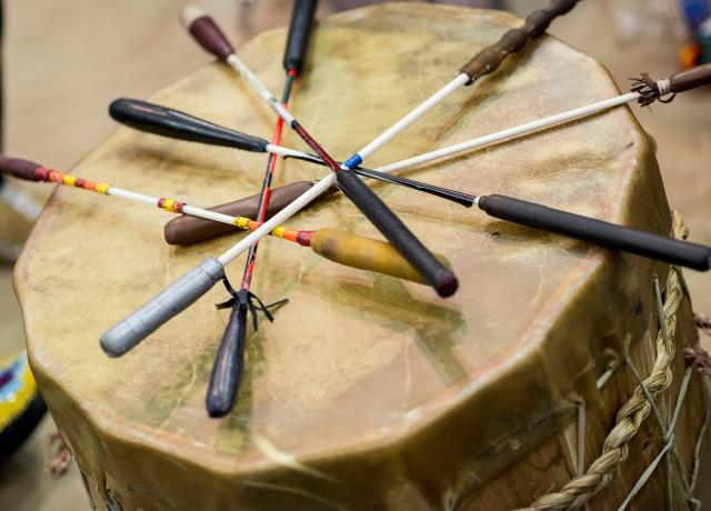 Native American drum with mallets laying on top