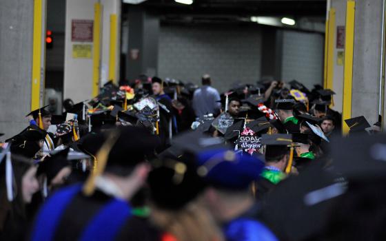crowd of students at graduation ceremony 