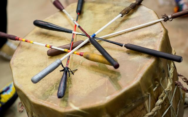 Native American drum with mallets laying on top